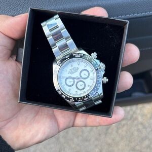 Rolex Silver Watch with White Dial and Black Details
